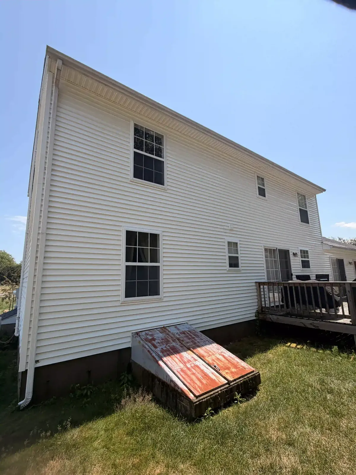 White two-story home after house washing