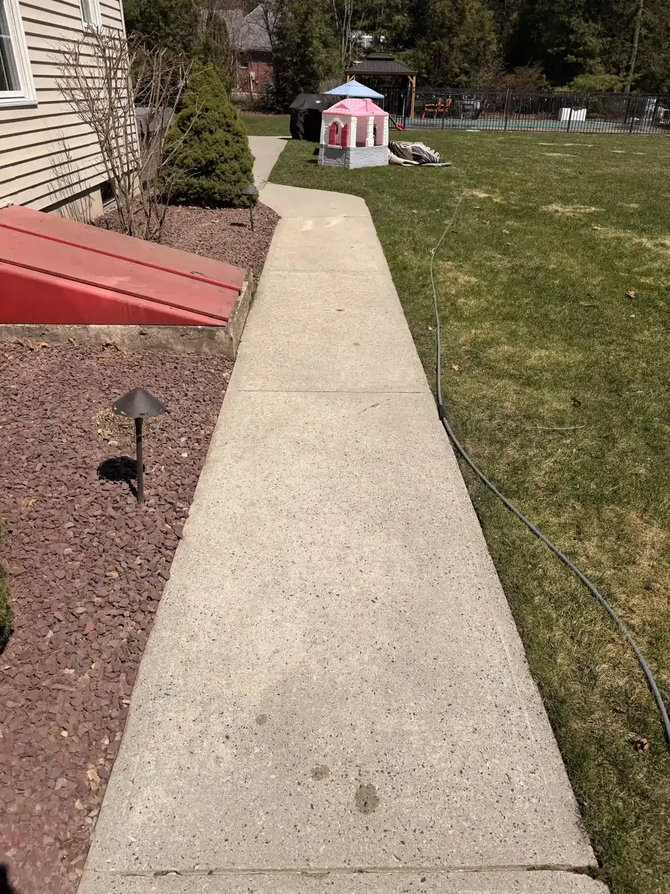 Concrete walkway after pressure washing